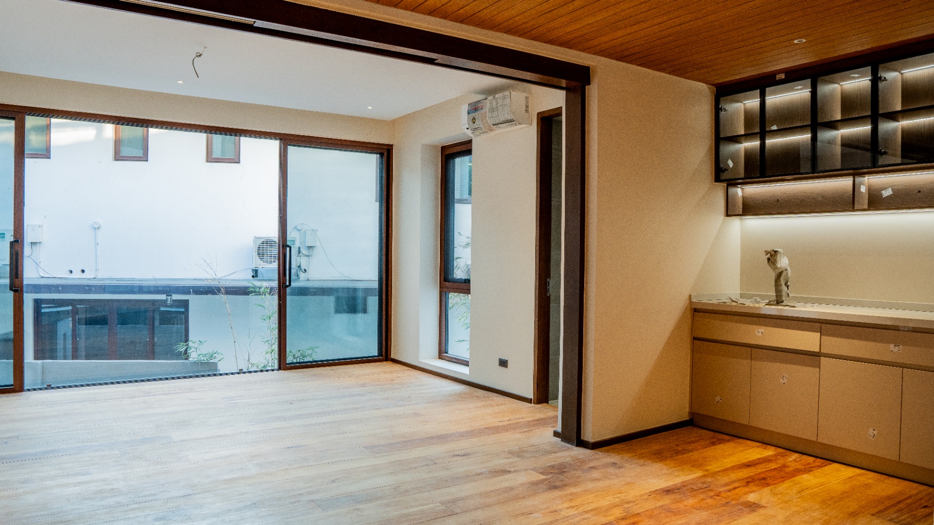 Second-floor kitchenette and lounge with narra plank flooring