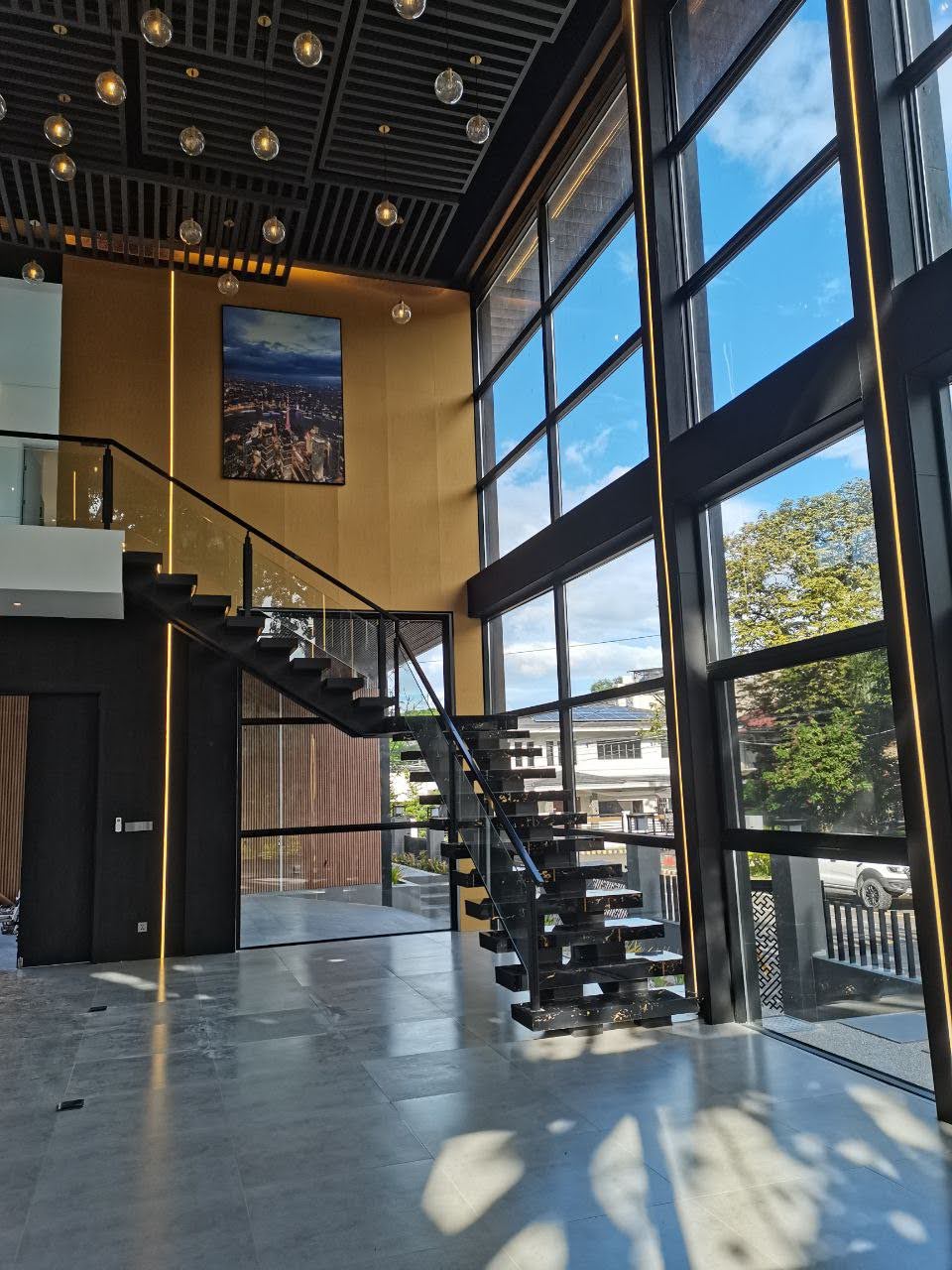 Floating marble staircase beneath a 7.6-metre glazed atrium