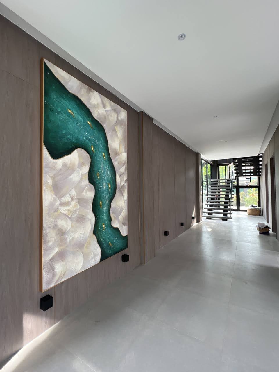 Gallery hallway with large abstract artwork