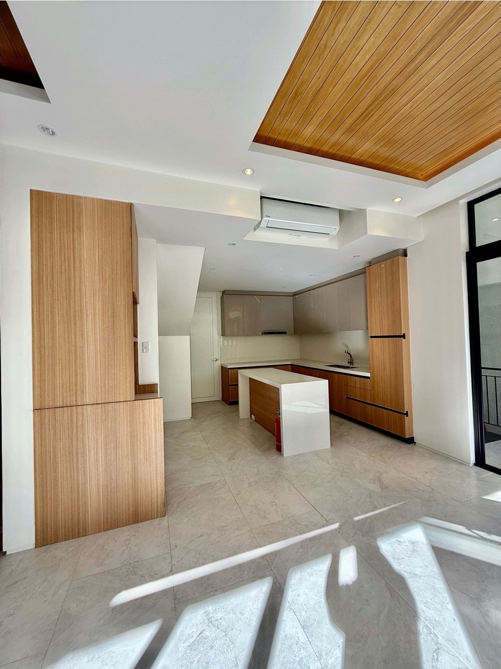 Modular kitchen with island and timber cabinetry