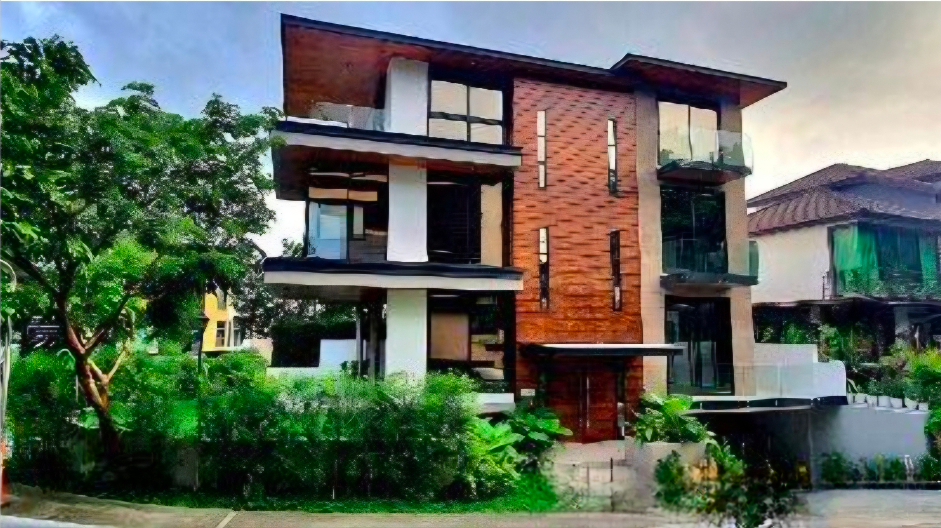 The McKinley Hill Narra Residence — contemporary three-storey facade in McKinley Hill Village, Taguig
