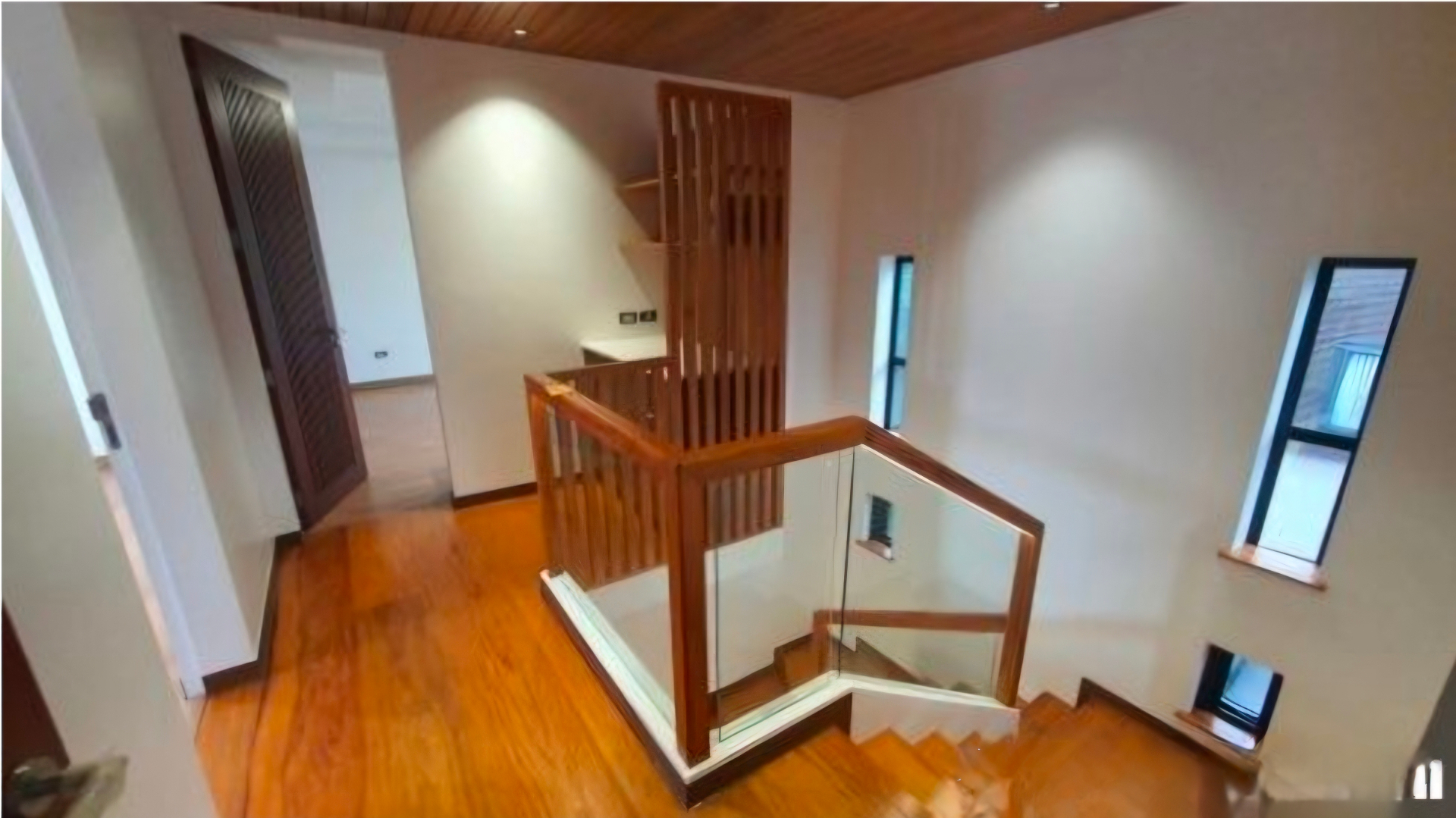 Upper landing with Narra floors and wood-slat screen