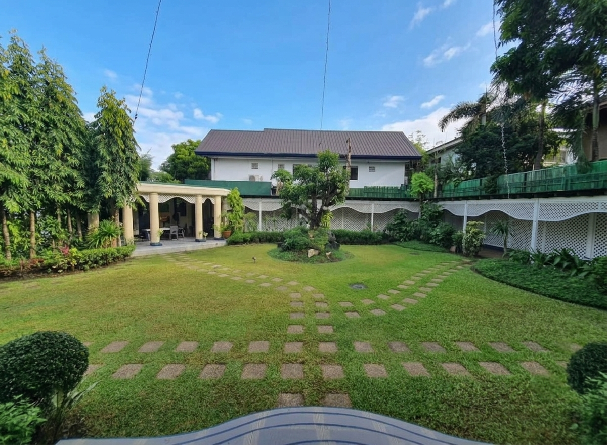 Four-storey Ayala Alabang estate viewed across its expansive landscaped garden