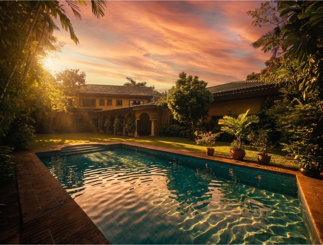 Swimming pool and Mediterranean villa at sunset in Ayala Alabang Village