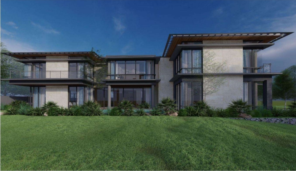 Rear elevation of the estate with full-height glazing overlooking the lawn