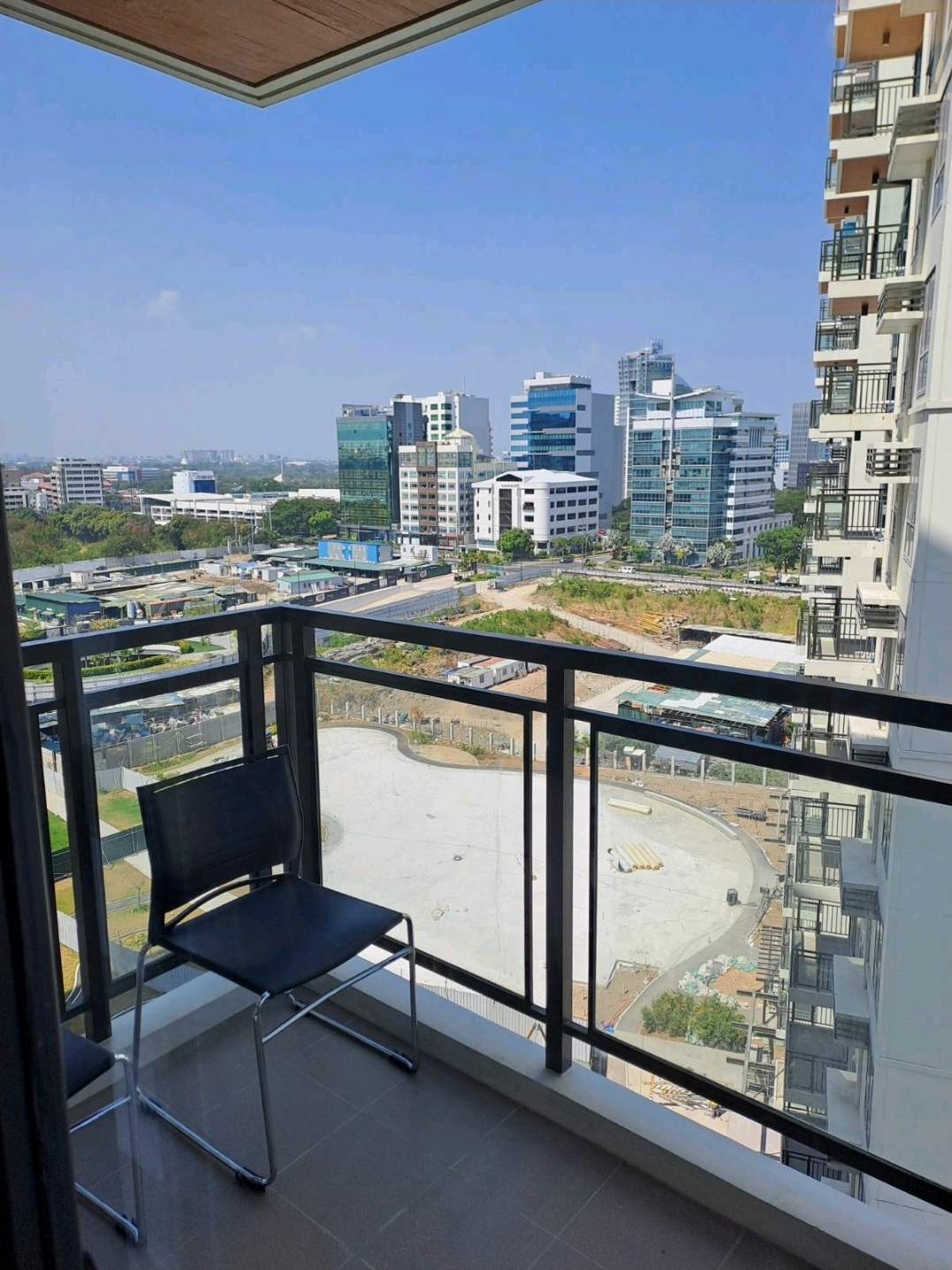 Balcony perspective showing the pool deck and neighbouring towers