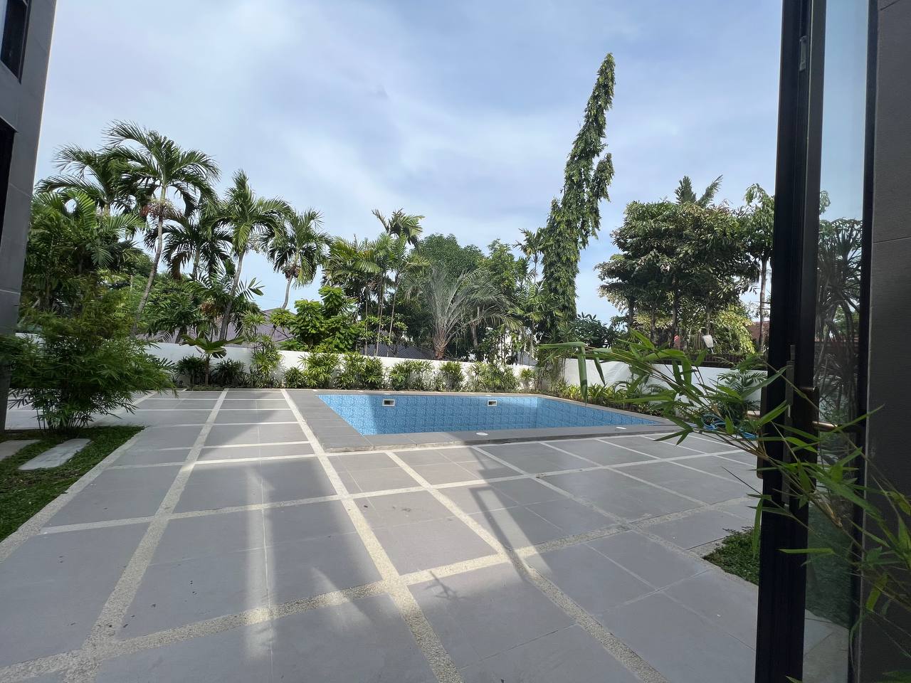 Swimming pool and landscaped garden in daylight