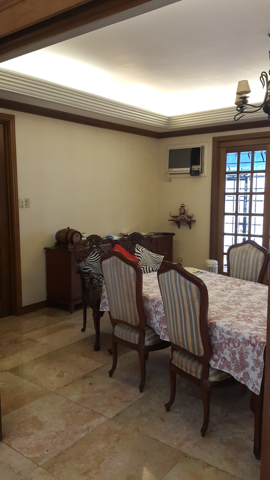Dining area with cove lighting and garden doors