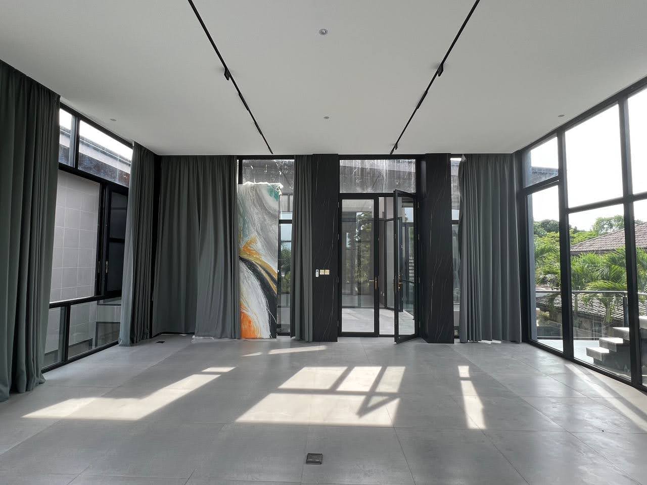 Living area with 3.6-metre ceilings and full-height glazing