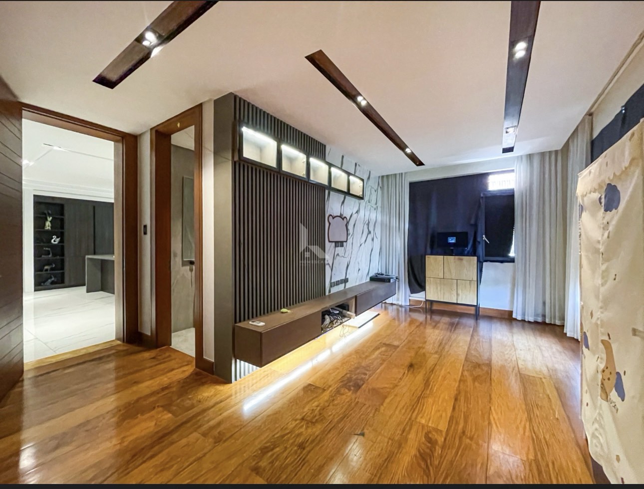 Media room with slat feature wall and marble accents