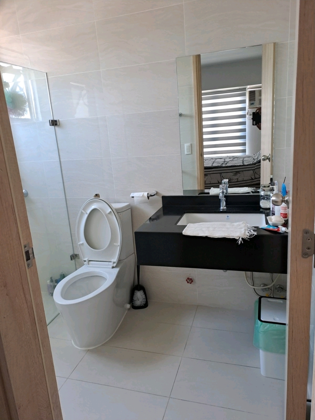 Master bathroom with black marble vanity and walk-in shower