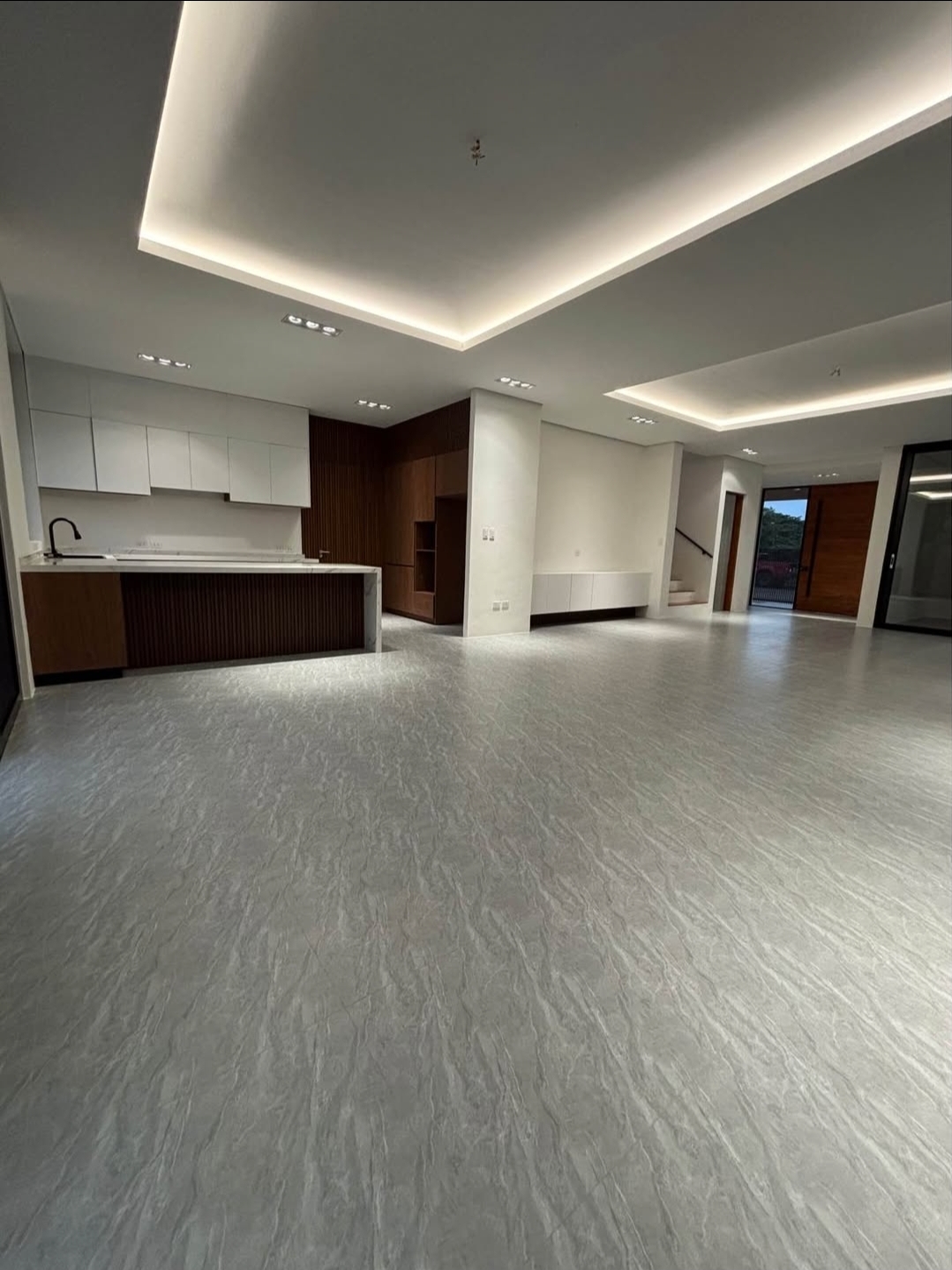 Modular kitchen with island, stone counters and timber cabinetry