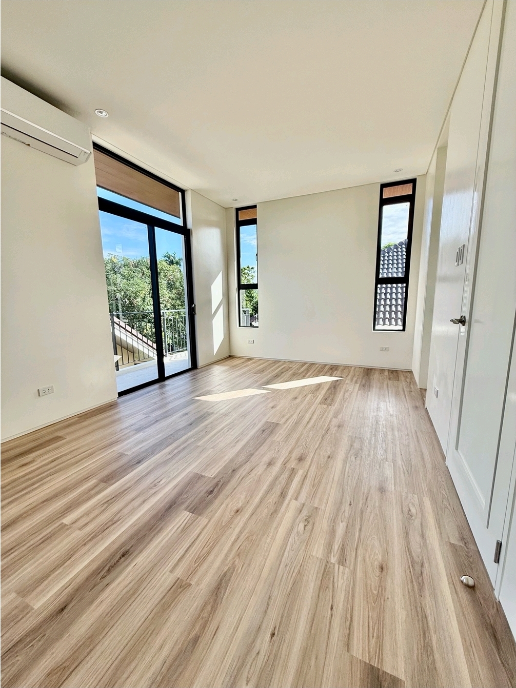 Bedroom opening to a private balcony