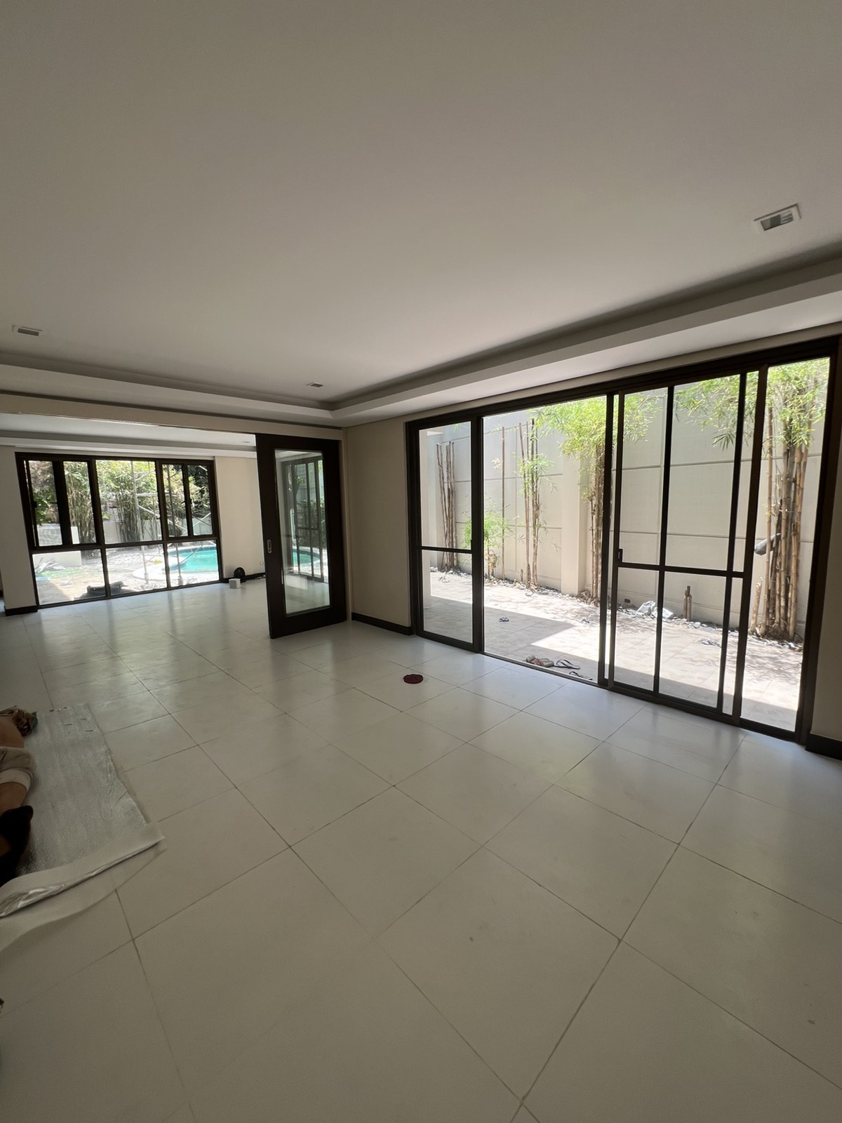 The San Lorenzo Village Garden Residence — great room opening to the pool, Makati