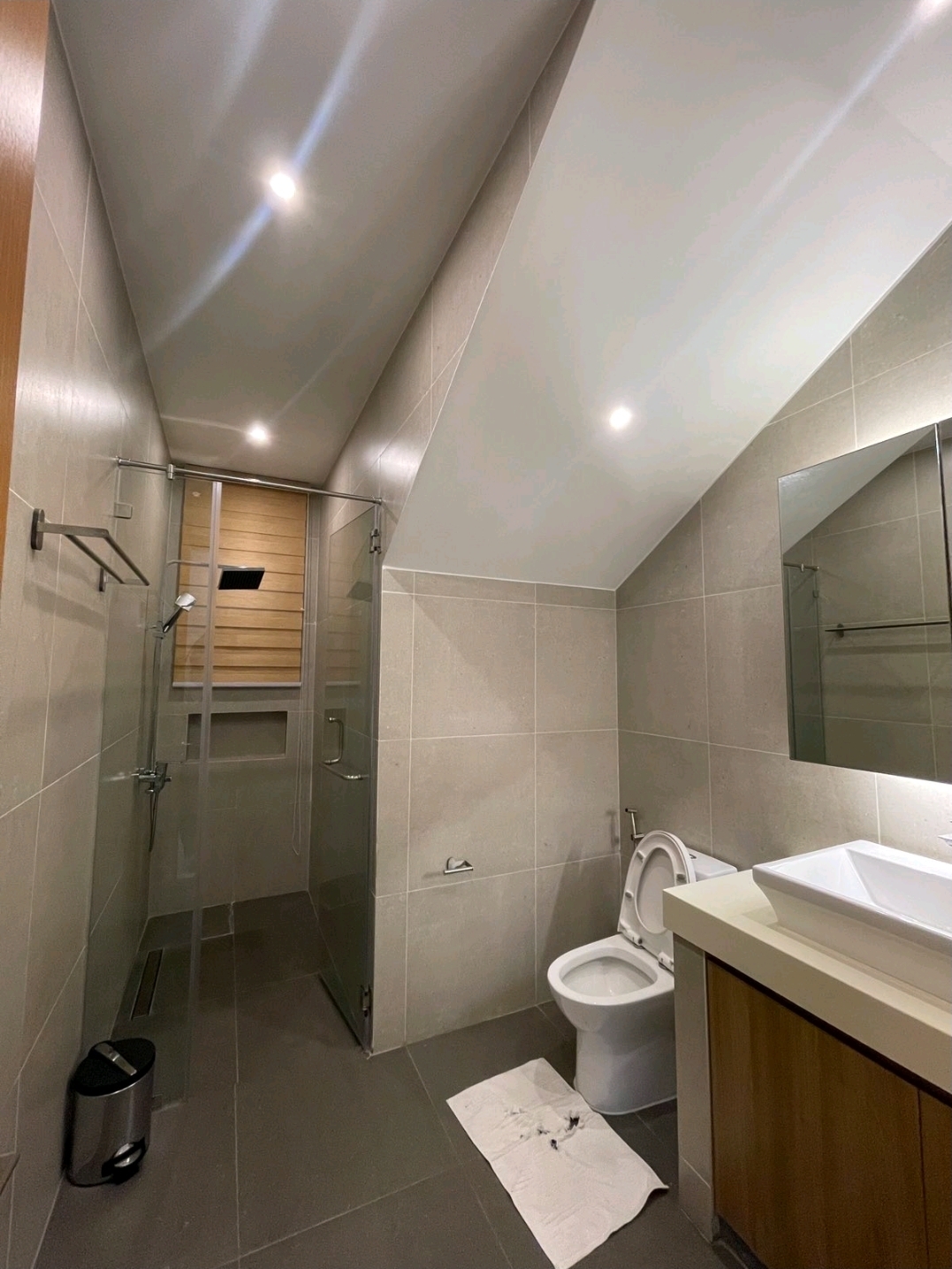 Modern tiled bathroom with walk-in shower