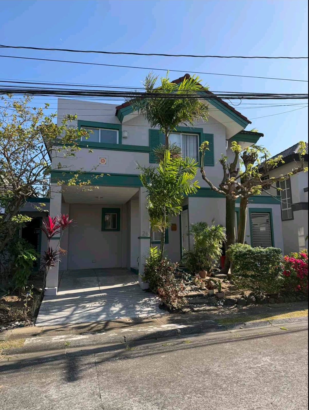 Two-storey family home with covered carport in Verdana Homes Daang Hari