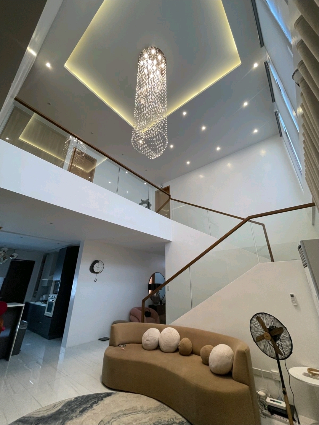 Double-height living atrium with crystal chandelier