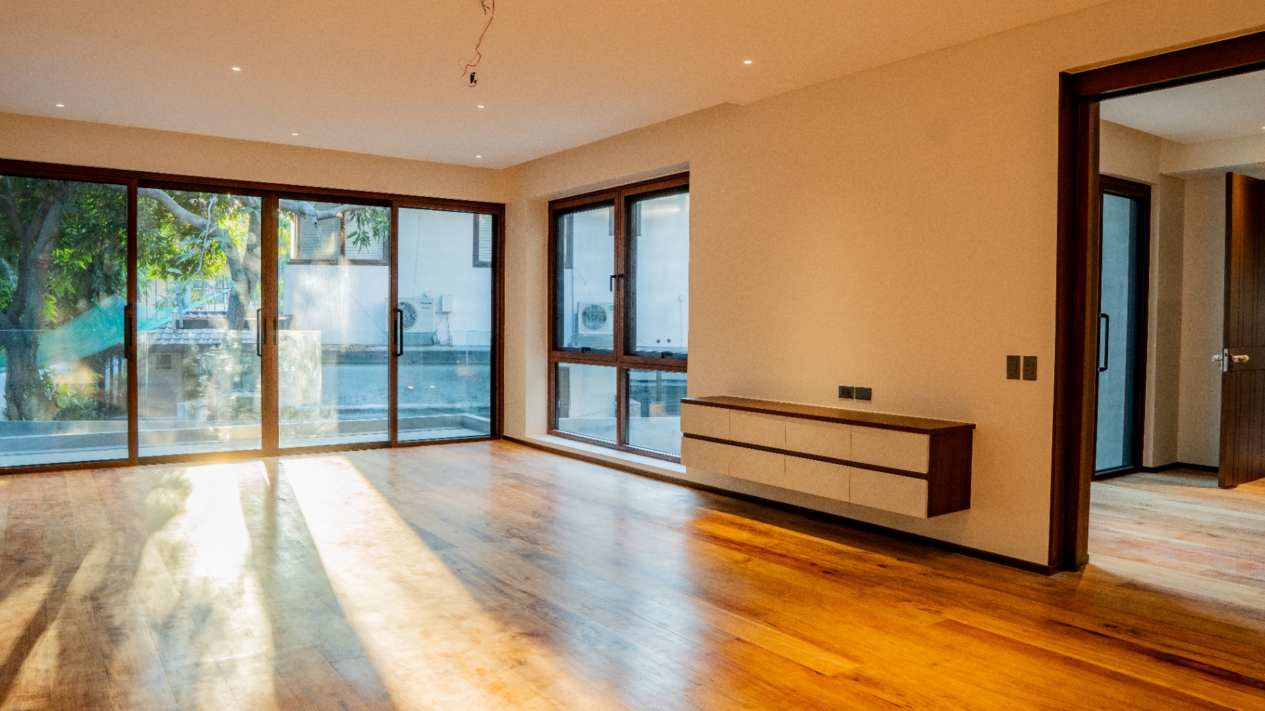 Master's bedroom with balcony access and floating console