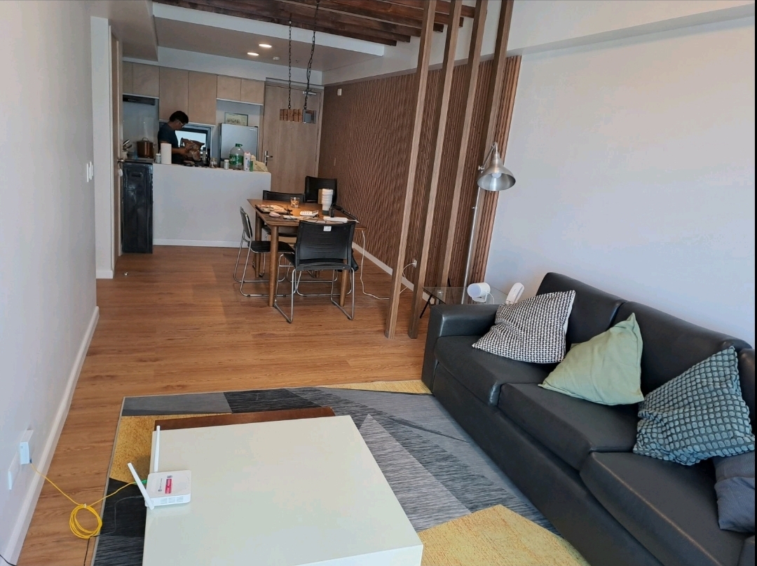 View from the living room toward the open kitchen with breakfast bar