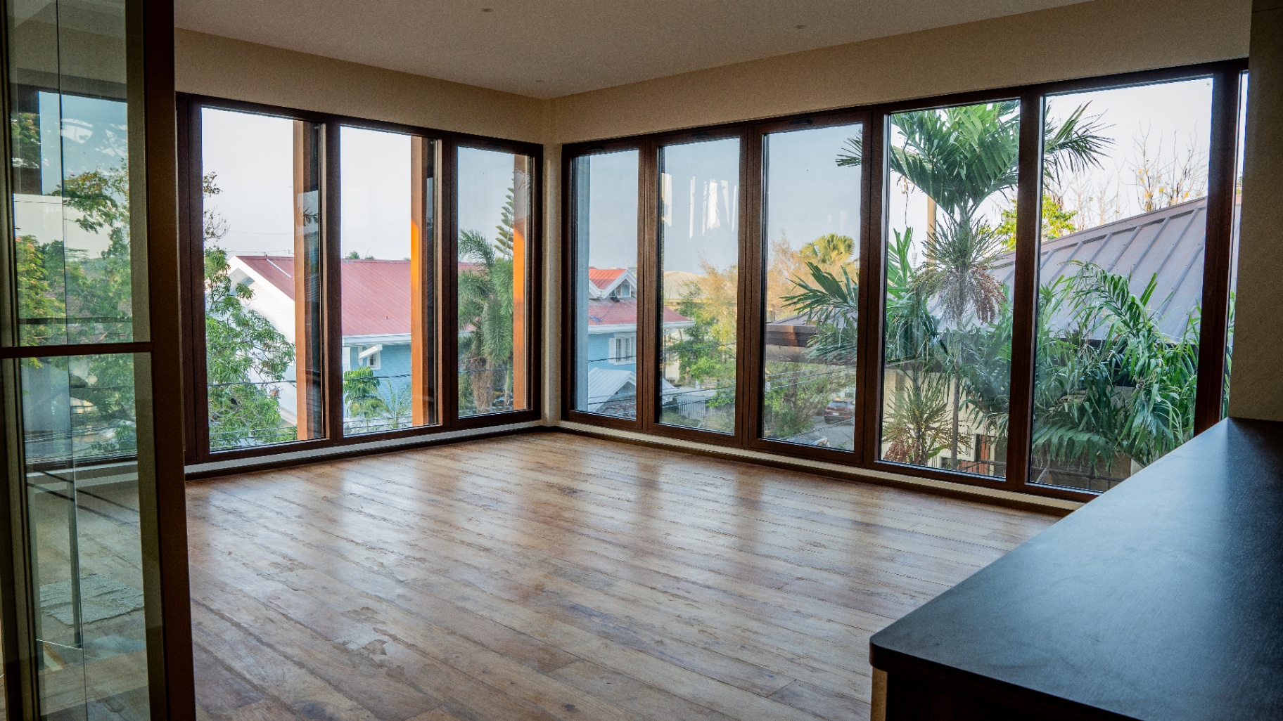 Third floor family hall with corner windows overlooking treetops