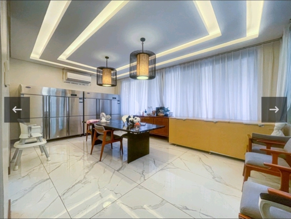 Dining room with coved lighting, marble flooring and pendant lanterns
