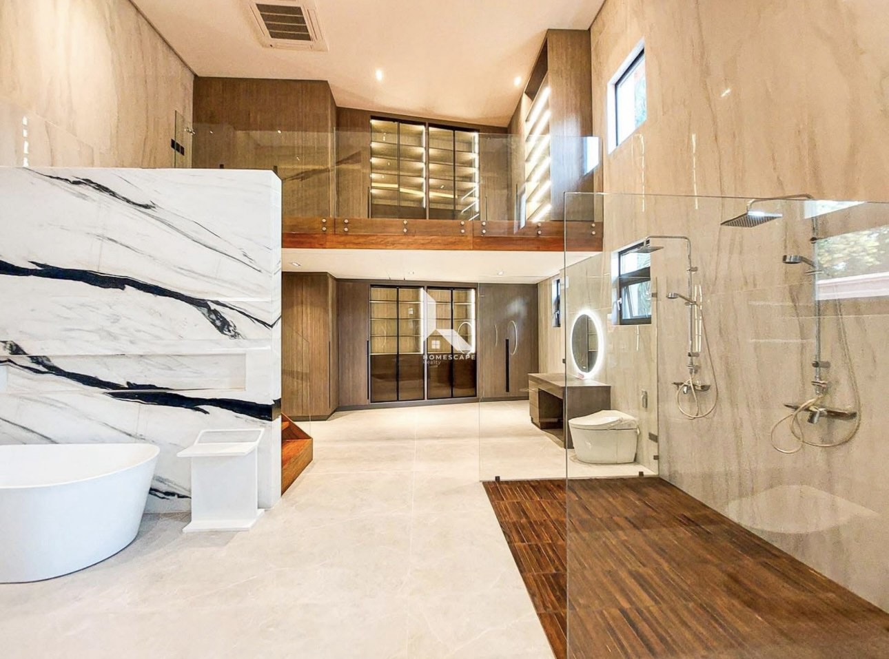 Spa-grade marble master bathroom with freestanding tub and twin showers