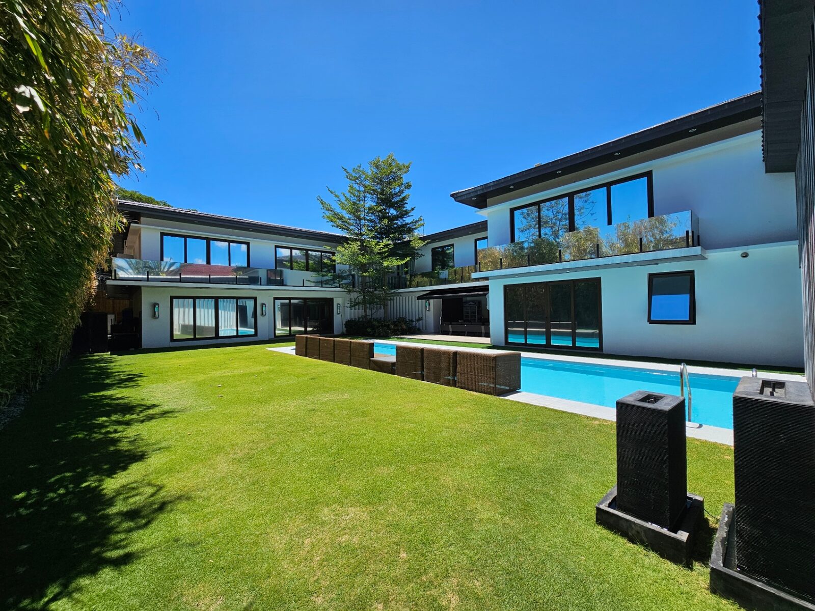 Modern corner mansion exterior with pool in Ayala Alabang Village